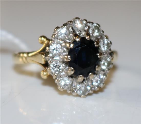 Sapphire and diamond cluster ring, yellow metal setting